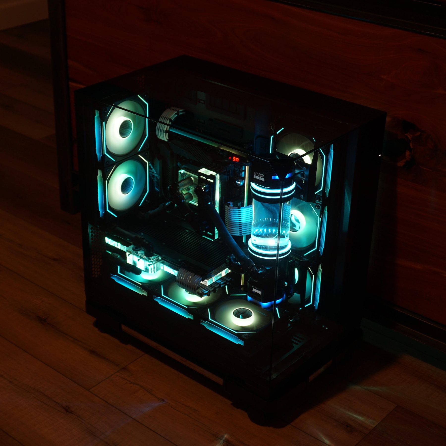 Lagavulin: V, a black Lian Li O11 Vision with a cyan-lit custom water loop