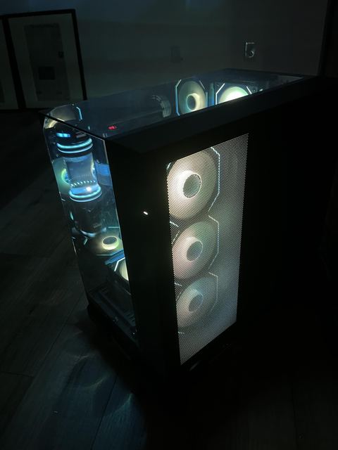 The micromesh side panel, with the push-pull radiator fans glowing through