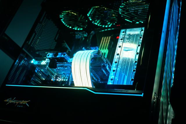 The main chamber at night, with hardline tubing and the GPU block