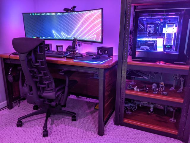 The desk, with the PC on the shelf beside it